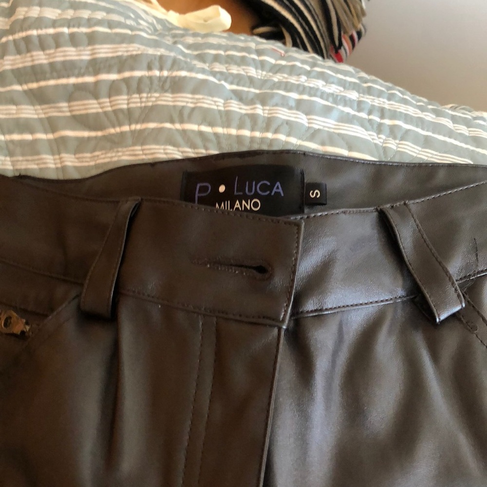 Black pleather pants. Size small.